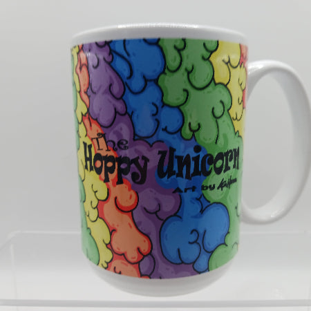Colorful mug with 'The Happy Unicorn' design on a white background