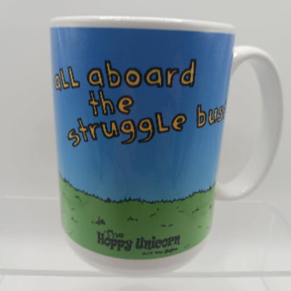 Mug with 'All aboard the struggle bus' text on a blue and green background